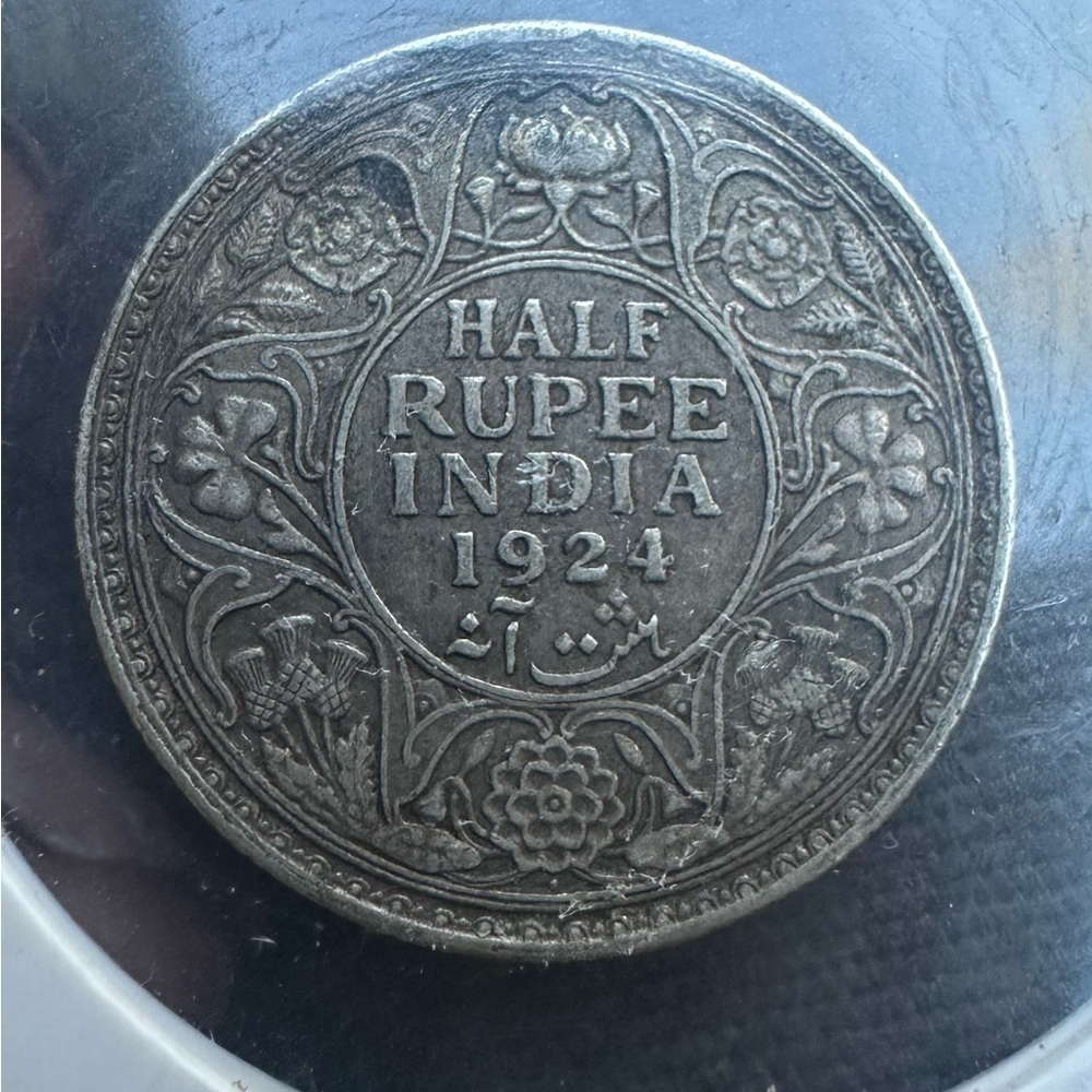 1924 silver 1/2 rupee. In good shape.